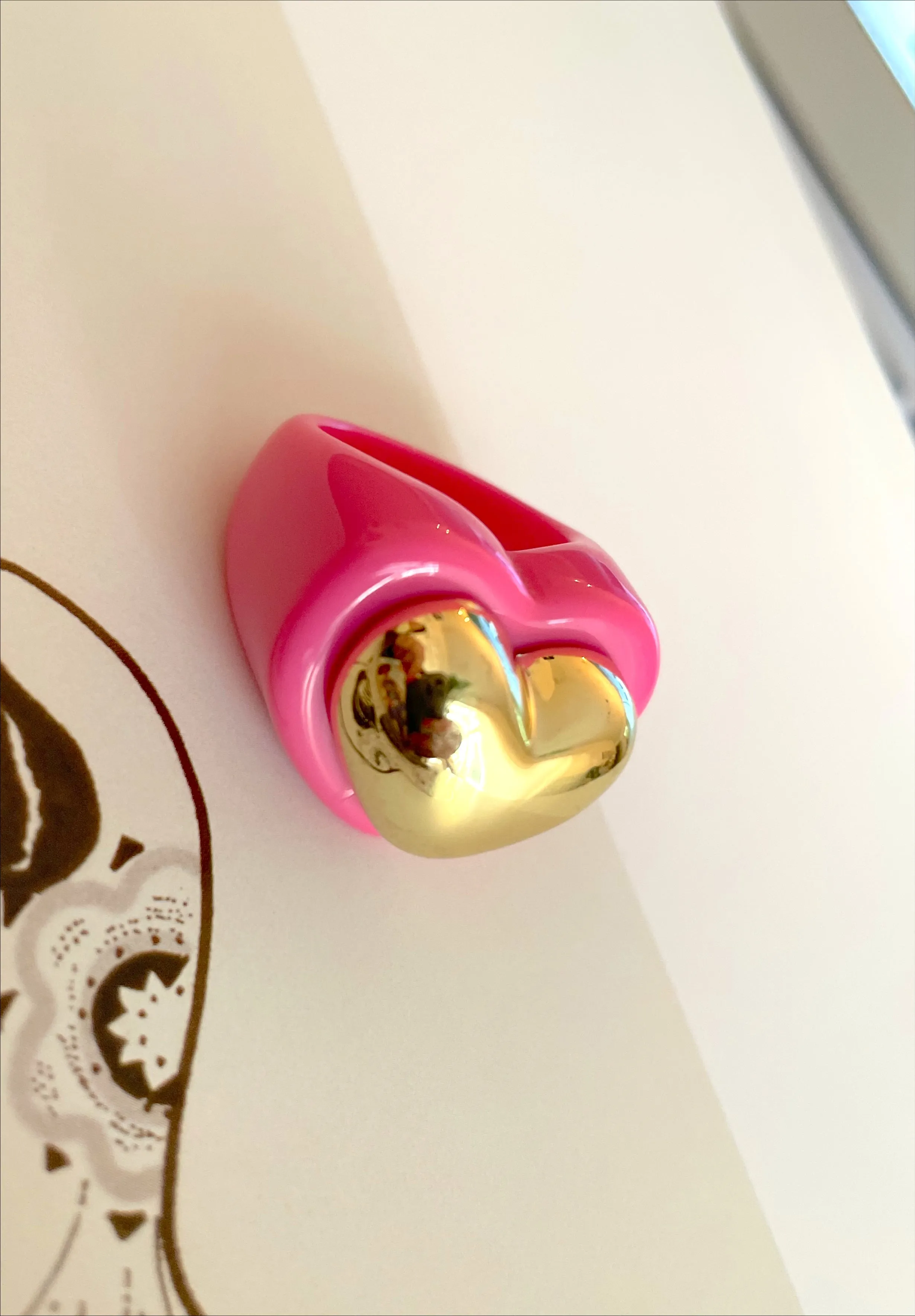 Acrylic heart shape with gold heart ring